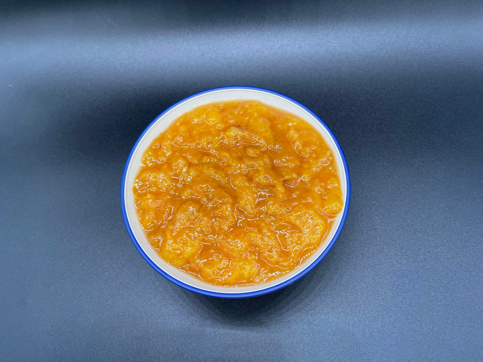 A bowl of homemade peach preserve